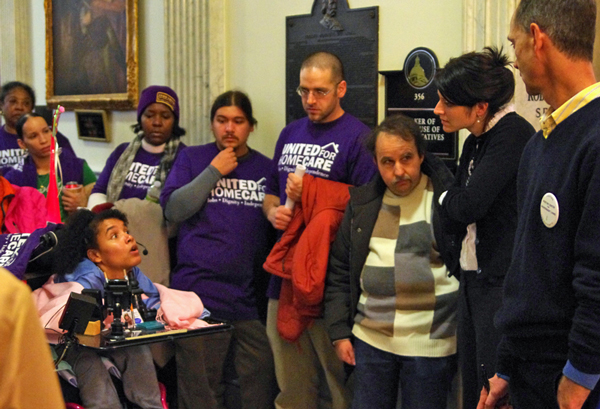 A PCA consumer speaks up at the Jan. 2011 PCA Rally to a staff person for Speaker of the House, DeLeo.